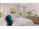 Bedroom featuring an accent mirror, soft bedding, and a tranquil window view at 640 Kimberwick Dr, Locust Grove, GA 30248