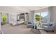 Spacious main bedroom featuring large windows, ample seating, and a large bed at 640 Kimberwick Dr, Locust Grove, GA 30248