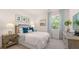 Serene bedroom with blue accents, natural light, and stylish furnishings for a peaceful retreat at 640 Kimberwick Dr, Locust Grove, GA 30248