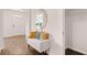 Inviting entryway featuring a bench with colorful throw pillows and a stylish mirror at 640 Kimberwick Dr, Locust Grove, GA 30248