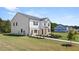 New home with a combination of siding and brick, a lush lawn, and mature trees at 640 Kimberwick Dr, Locust Grove, GA 30248