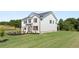 Two-story home with white siding, brick accents, black shutters, and a well-maintained front yard at 640 Kimberwick Dr, Locust Grove, GA 30248
