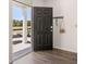 Home's open front door with a glimpse of the outdoors on a sunny day at 640 Kimberwick Dr, Locust Grove, GA 30248