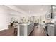 Modern kitchen featuring a gray island with stainless steel appliances and hardwood floors at 640 Kimberwick Dr, Locust Grove, GA 30248