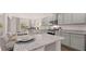 A detailed view of the kitchen island with granite countertops and stainless steel sink at 640 Kimberwick Dr, Locust Grove, GA 30248