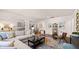 Open concept living room featuring a sofa, hardwood floors and neutral color palette at 640 Kimberwick Dr, Locust Grove, GA 30248