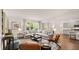 Spacious living room with modern decor, a comfortable sectional sofa, and large windows showcasing the outdoors at 640 Kimberwick Dr, Locust Grove, GA 30248