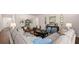 Spacious living room with modern decor, comfortable seating, and stylish furnishings at 640 Kimberwick Dr, Locust Grove, GA 30248