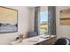 Bright office featuring a modern desk, artwork, and large window with natural light at 640 Kimberwick Dr, Locust Grove, GA 30248