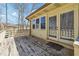 Wooden back deck with access to backyard and house with screened doors and windows at 9975 Holly Hill Way, Jonesboro, GA 30238