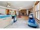 Spacious basement area with a brick fireplace and multiple windows at 9975 Holly Hill Way, Jonesboro, GA 30238