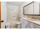 Standard bathroom features a tub-shower combo, single sink vanity, toilet and medicine cabinet at 9975 Holly Hill Way, Jonesboro, GA 30238
