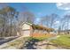 Brick home with an attached garage, long driveway, and well-kept lawn at 9975 Holly Hill Way, Jonesboro, GA 30238
