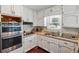 Functional kitchen with stainless steel appliances, light countertops, and lots of cabinet space at 9975 Holly Hill Way, Jonesboro, GA 30238