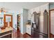 Well-equipped kitchen with a stainless steel refrigerator and adjacent pantry at 9975 Holly Hill Way, Jonesboro, GA 30238