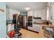 Bright kitchen with stainless steel appliances, tile countertops, and ample cabinet space at 9975 Holly Hill Way, Jonesboro, GA 30238