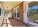 Relaxing front porch features comfortable seating and a view of the surrounding landscape at 9975 Holly Hill Way, Jonesboro, GA 30238