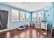 Bright sunroom featuring windows, hardwood floors and a door to the outside at 9975 Holly Hill Way, Jonesboro, GA 30238
