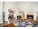 Open living room with a fireplace and doorway to dining area at 2099 Winsburg Nw Way, Kennesaw, GA 30144