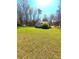 View of a spacious backyard with an additional detached building; room to roam at 2958 Klondike Rd, Lithonia, GA 30038