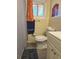 Modest bathroom with toilet, updated vanity, and shower at 2958 Klondike Rd, Lithonia, GA 30038