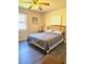 Simple bedroom with ceiling fan, neutral walls and natural light at 2958 Klondike Rd, Lithonia, GA 30038