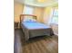 Cozy bedroom with wood-look flooring and natural light from two windows at 2958 Klondike Rd, Lithonia, GA 30038