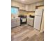 Efficient kitchen design with matching appliances, light gray cabinets, and ample counter space at 2958 Klondike Rd, Lithonia, GA 30038