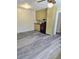 Open kitchen area with gray floors, olive green cabinets, a black countertop, and a black gas range at 2958 Klondike Rd, Lithonia, GA 30038