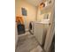 Small laundry room featuring stackable laundry appliances at 2958 Klondike Rd, Lithonia, GA 30038