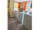 Bright laundry room featuring full sized washer and dryer with shelving at 2958 Klondike Rd, Lithonia, GA 30038
