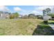 The large backyard features a well-kept lawn, mature trees, and a wooden privacy fence, ensuring a serene outdoor experience at 3313 Summit Creek Ln, Loganville, GA 30052