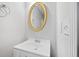 Bathroom featuring a vanity, a mirror with gold trim and a towel rack at 3313 Summit Creek Ln, Loganville, GA 30052