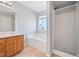 Bright bathroom featuring neutral walls, tile floors, a shower and a soaking tub at 3313 Summit Creek Ln, Loganville, GA 30052