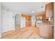 The kitchen features hardwood floors, a kitchen nook, modern lighting, and stainless steel appliances at 3313 Summit Creek Ln, Loganville, GA 30052