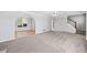 Open-concept living room with fireplace and archway to the dining room at 3313 Summit Creek Ln, Loganville, GA 30052