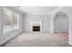 Spacious living room featuring a fireplace, large window and neutral color scheme at 3313 Summit Creek Ln, Loganville, GA 30052