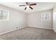 Spacious bedroom featuring plush carpeting, neutral paint, and two windows providing ample natural light at 446 Martindale Ct, Stone Mountain, GA 30088