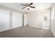 Spacious bedroom with neutral carpeting and a ceiling fan for added comfort at 446 Martindale Ct, Stone Mountain, GA 30088