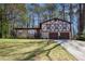 Charming two-story home with a brick facade, updated windows, and an attached two-car garage at 446 Martindale Ct, Stone Mountain, GA 30088