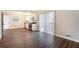 Open concept living space featuring modern kitchen with stainless steel appliances and dining area at 446 Martindale Ct, Stone Mountain, GA 30088