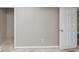 A basement room with grey walls, white trim and open closet at 6405 Grafton Dr, Austell, GA 30168