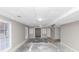 Unfinished basement with drop ceiling, concrete floor, support beam and windows at 6405 Grafton Dr, Austell, GA 30168