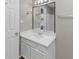 Bathroom featuring a large mirror, sink, and neutral colors at 6405 Grafton Dr, Austell, GA 30168