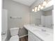 Bathroom featuring a vanity, white cabinets, and light fixture at 6405 Grafton Dr, Austell, GA 30168