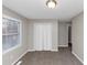 Carpeted bedroom with a window and closet featuring bifold doors at 6405 Grafton Dr, Austell, GA 30168