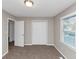 Bedroom with a window, closet, and new neutral carpet at 6405 Grafton Dr, Austell, GA 30168