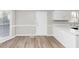 Bright eat-in kitchen boasts white cabinets, laminate countertops and a window view at 6405 Grafton Dr, Austell, GA 30168