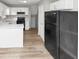 Bright kitchen with black appliances and white cabinets at 6405 Grafton Dr, Austell, GA 30168