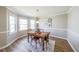 Cozy dining room with a classic table set and natural light from nearby windows at 1692 Cumberland Trce, Acworth, GA 30102